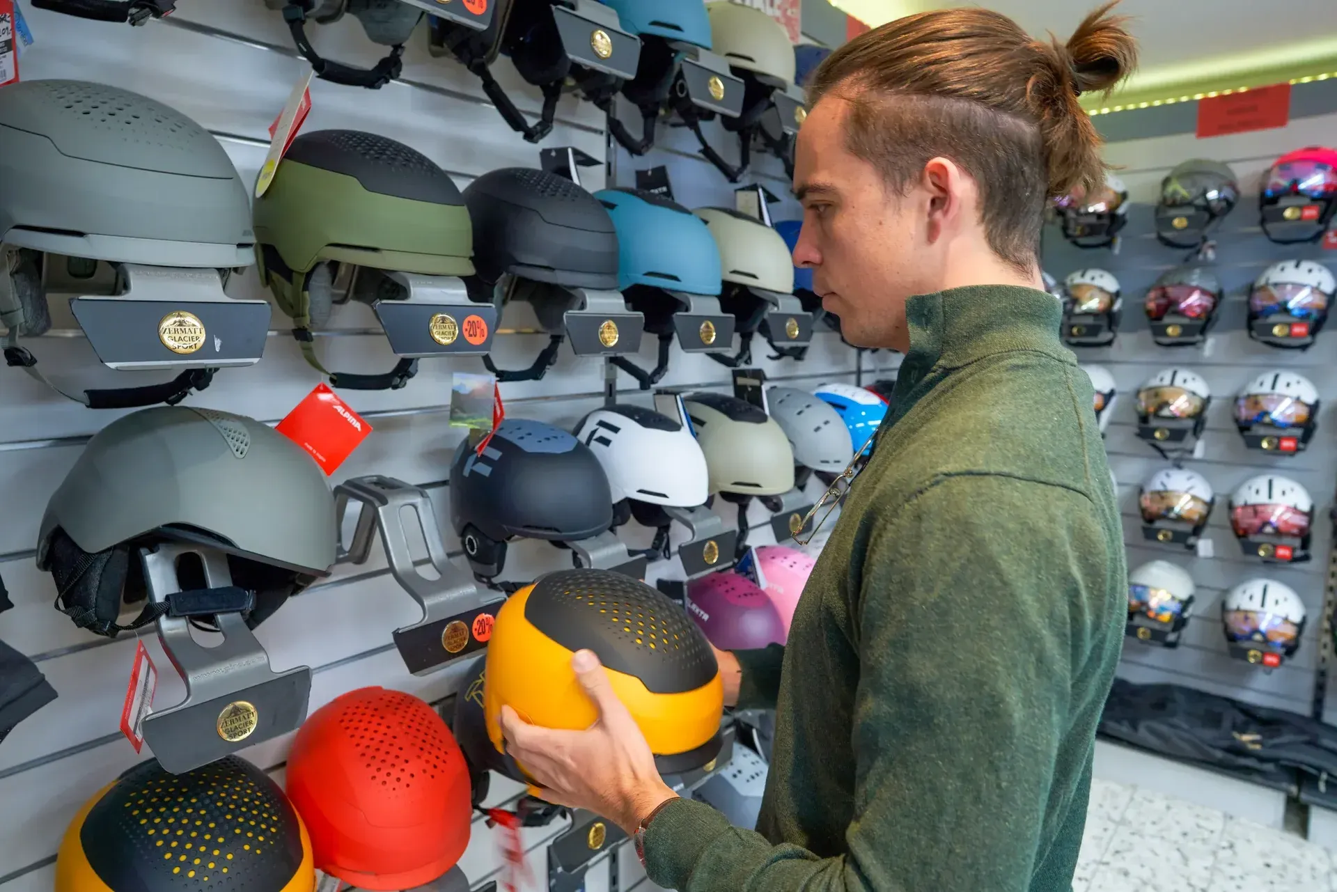 Shelf with ski helmets in the rental shop